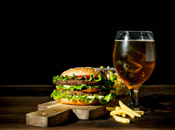 istock Burger with beer in a glass and fries. 1144175295