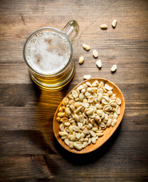 istock Beer and peanuts in the bowl. 1144175400
