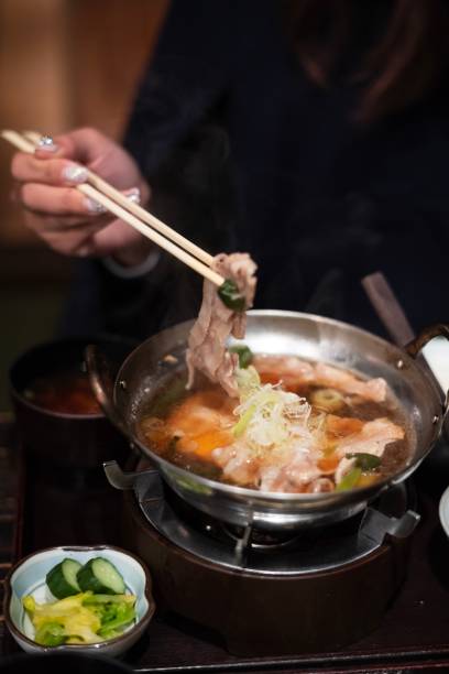 istock Delicious Japanese hot pot sukiyaki on dining table 1144175892