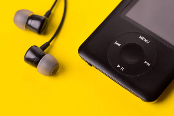 istock Black headphones and player close-up. 1144176006