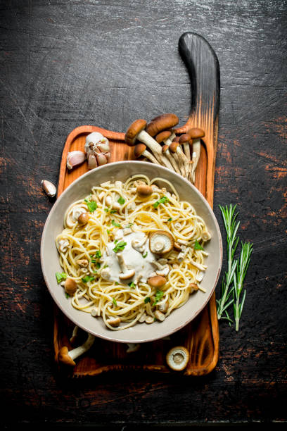 istock Pasta with mushrooms in bowl and rosemary. 1144176246