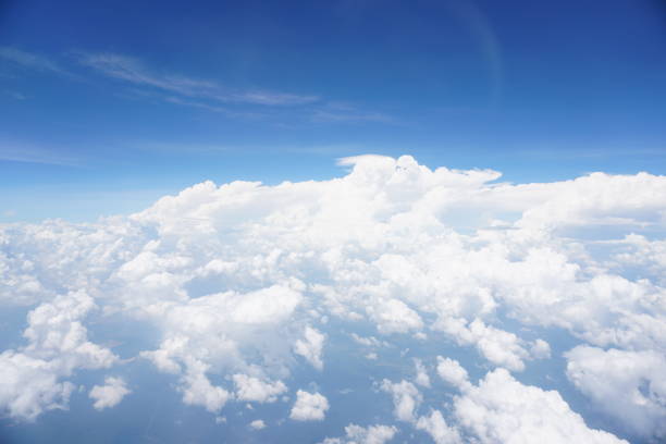 istock Clouds and sky as seen through window of an aircraft 1144178385