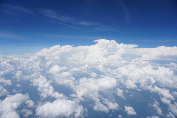 istock Clouds and sky as seen through window of an aircraft 1144178615