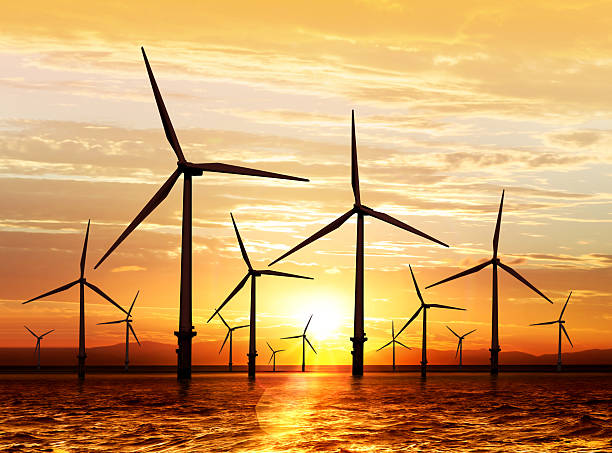 wind turbine on sunset silhouette of wind turbine on sunset windmill sunset stock pictures, royalty-free photos & images