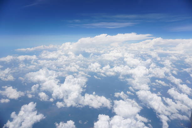 istock Clouds and sky as seen through window of an aircraft 1144178820