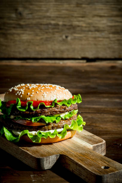 istock One Burger with beef,salad and vegetables. 1144178852