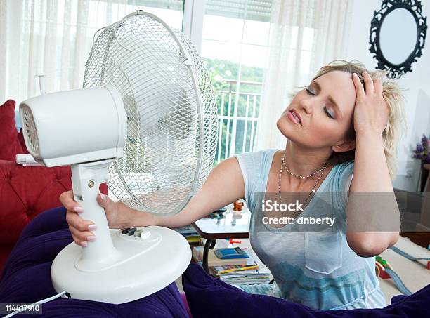 Woman Cooling Herself Stock Photo - Download Image Now - Heat - Temperature, Sweat, Indoors