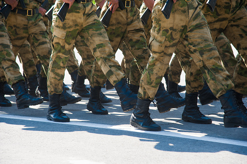 Chai, North Kivu, DRC - March 29, 2014: FDLR soldiers marching and training on an abandon football field before patrols.