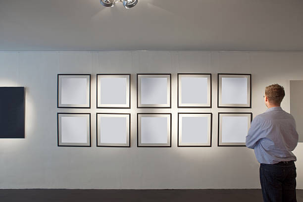 istock Man looking at artwork in a gallery 114417928