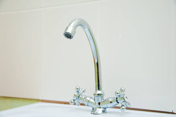 istock Metal faucet in a kitchen 1144182979
