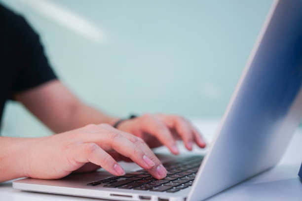 close up man hand typing on keyboard laptop for searching data on web browser , internet of thing concept