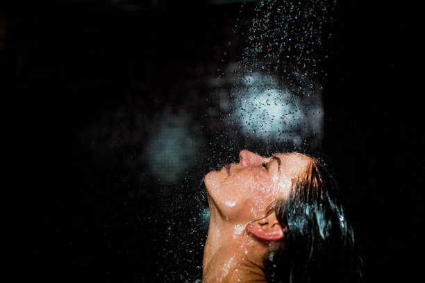 istock Beautiful Woman Taking a Shower 1144185151