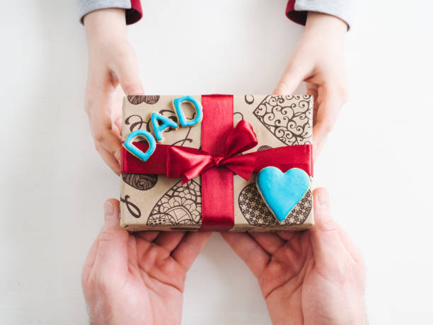 istock Child congratulating his Father. Preparing for the Fathers Day 1144185556