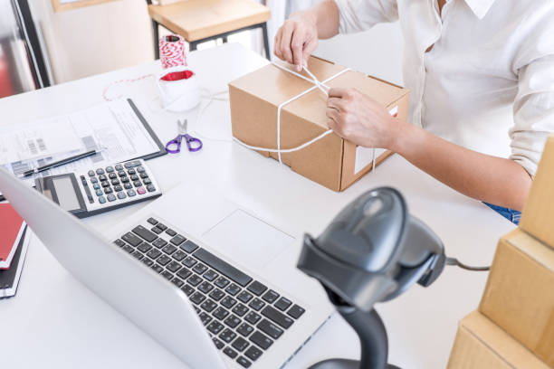 istock Small business owner delivery service and working packing box, business owner working checking order to confirm before sending customer in post office, Shipment Online Sales 1144187050