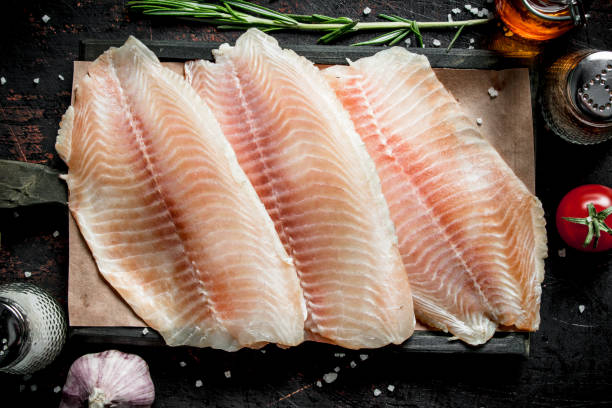 istock Fish fillet on paper on a cutting Board. 1144187887