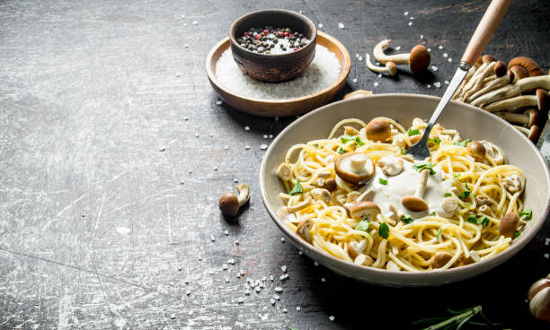 istock Pasta with mushrooms and sauce in a plate. 1144187934