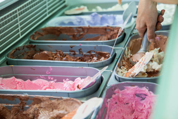 istock Trays of ice cream. Man serving ice cream. 1144188047