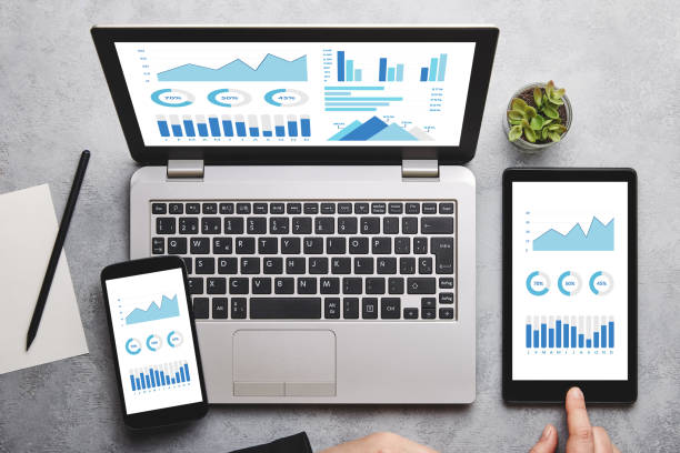 istock Graphs and charts elements on laptop, tablet and smartphone screen 1144188382