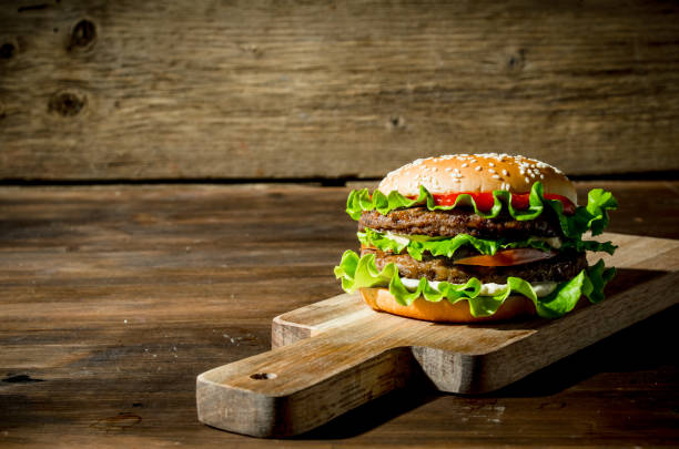 istock One Burger with beef,salad and vegetables. 1144189795