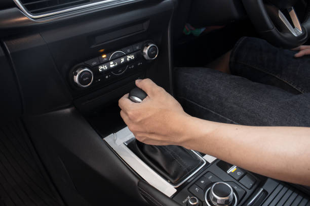 istock Hand on shifting  gear on car ,man driving car. 1144190618