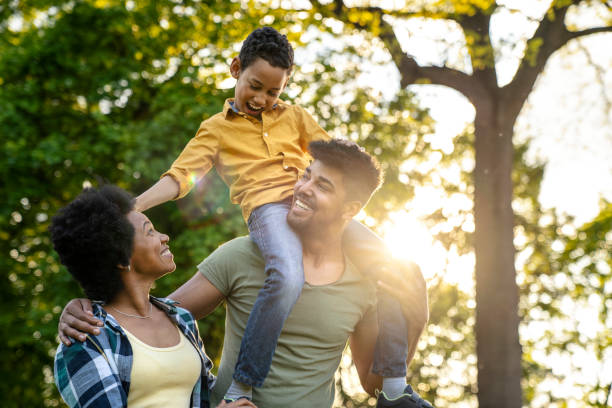 istock Young loving family having fun in the park 1144190775