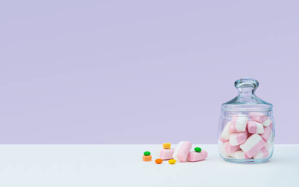 istock Marshmallow with dragee next to the glass transparent jar and in it 1144192542