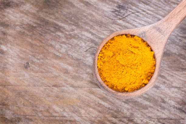 istock Turmeric powder and fresh turmeric - Curcuma longa. 1144193498