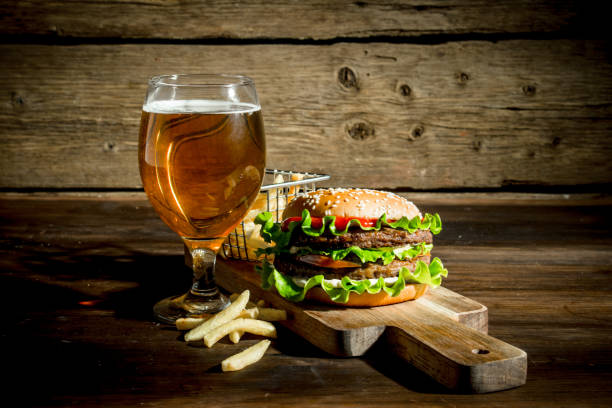 istock Burger with beer in a glass and fries. 1144193782