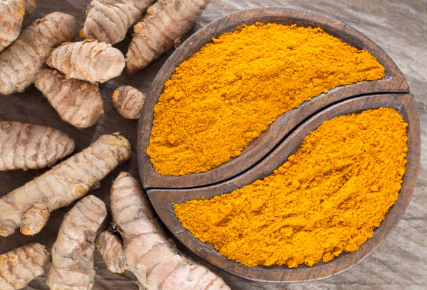 istock Turmeric powder and fresh turmeric - Curcuma longa. 1144193897