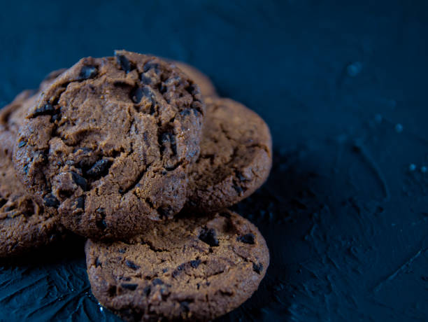 istock Chocolate chip cookies on a dark stone background 1144194373