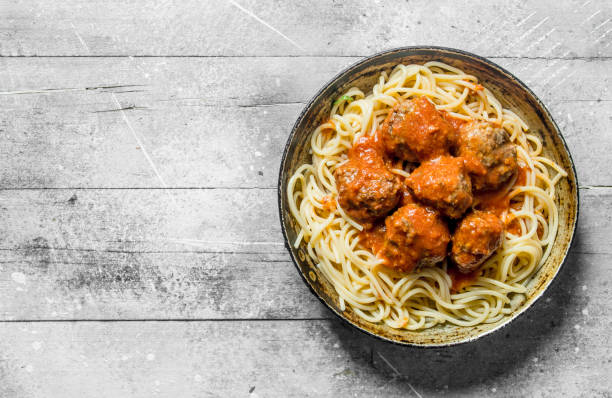 istock Spaghetti with meat balls in pan. 1144194986
