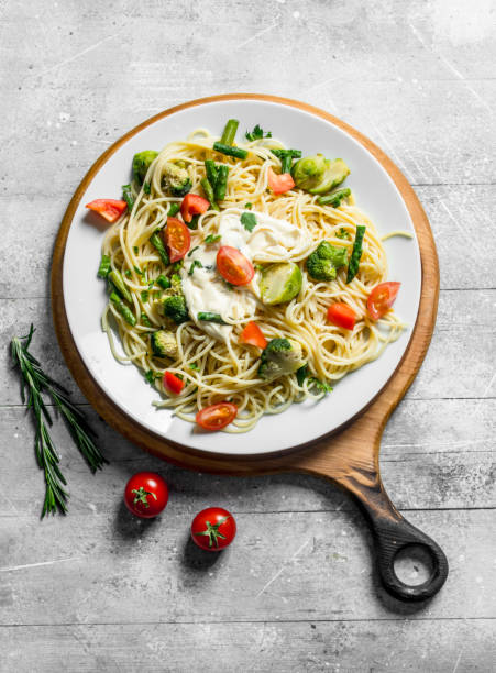 istock Vegetable paste in a plate on a cutting Board with rosemary and tomatoes. 1144195239