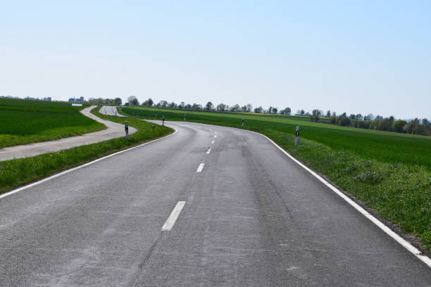 istock sunny country road 1144195500