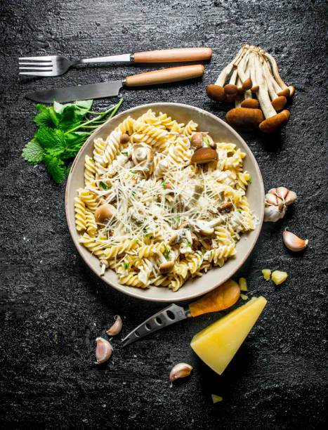 istock Fusilli pasta with mushrooms,mint leaves and Parmesan. 1144196678