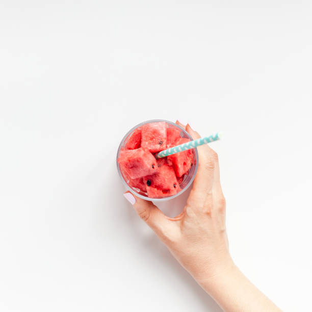 istock Woman hands with crushed watermelon in glass 1144197856