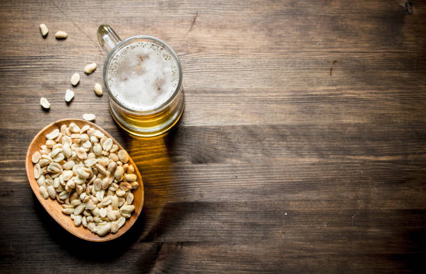 istock Beer and peanuts in the bowl. 1144197920