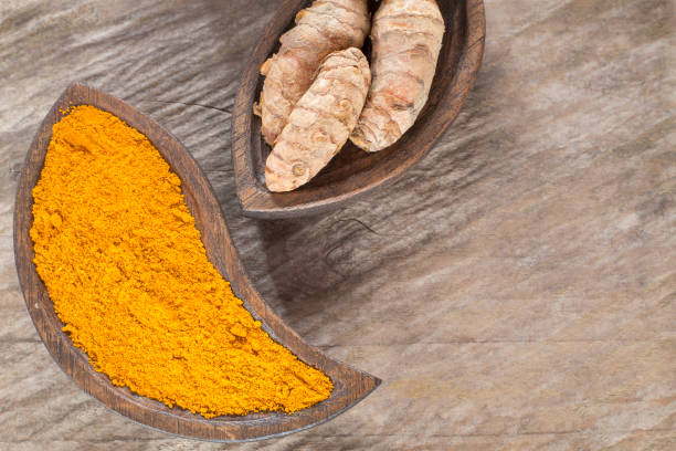 istock Turmeric powder and fresh turmeric - Curcuma longa. 1144197943