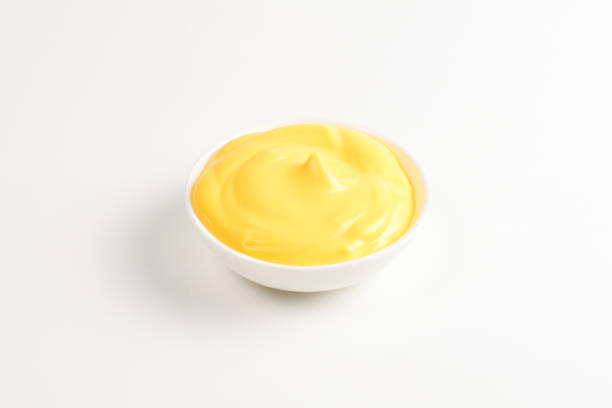 istock Cheese sauce in white plate on white background. 1144199639