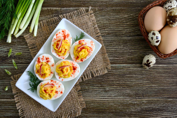Deviled eggs. Delicious appetizer. Boiled eggs stuffed with yolk, mustard, mayonnaise, paprika. Classic recipe. The top view