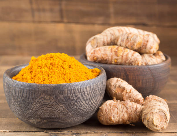 istock Turmeric powder and fresh turmeric - Curcuma longa. 1144200916