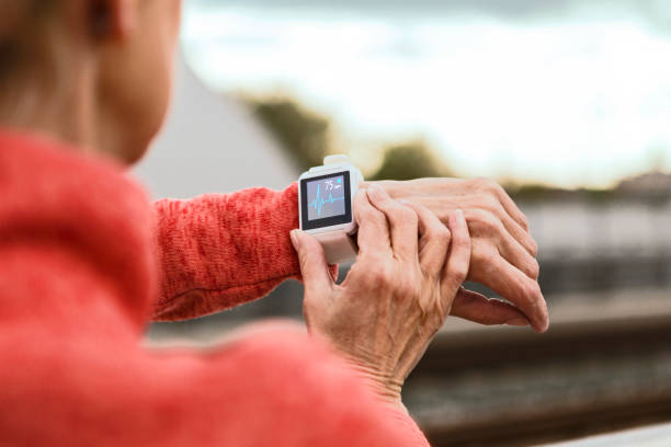 istock Athletic senior woman using smart watch 1144201332