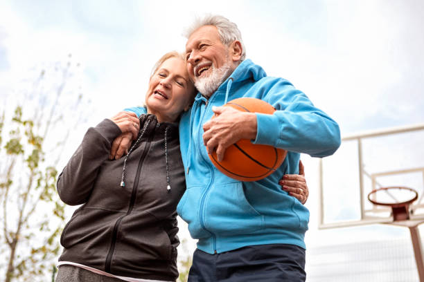 istock Seniors having fun on basketball court 1144201335