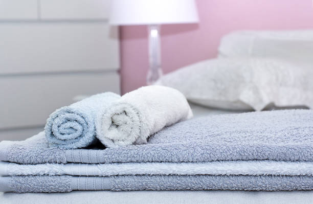 istock Stack of bath towels on bed decoration in bedroom interior 1144202863