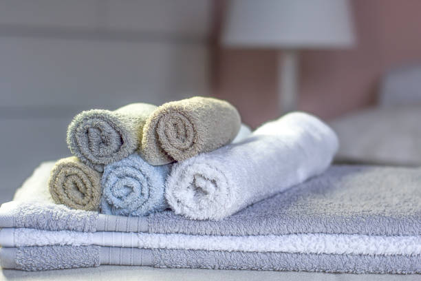 istock Stack of bath towels on bed decoration in bedroom interior 1144202882