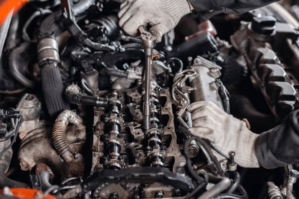 istock Unscrews the nut with the tool. Repairing of modern diesel engine, workers hands and tool. 1144203607