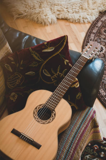 istock Guitar and pillow placed on the sofa at living room 1144204445