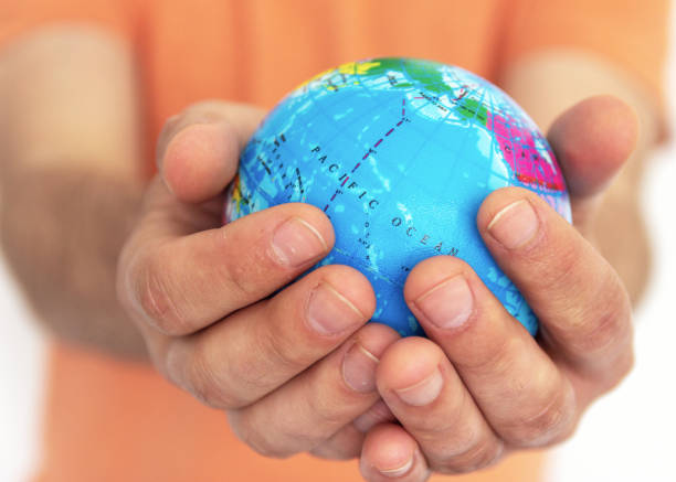 istock Hand of the person holds globe 1144205071