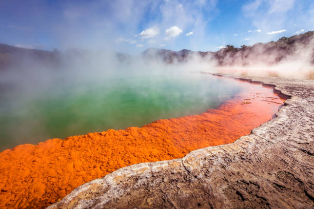 Thermal pool Geothermal hit pool with orange formations and steam rising rotorua stock pictures, royalty-free photos & images
