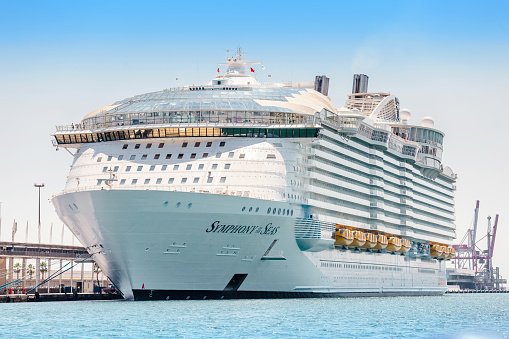 29 JULY 2018, BARCELONA, SPAIN: Symphony of the seas is the biggest cruise ship, parked in Barcelona port