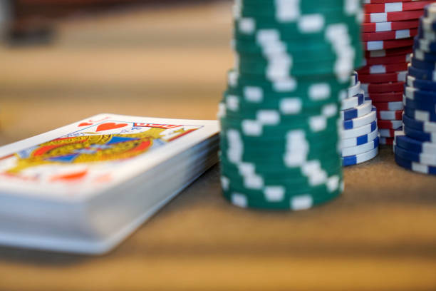 playing cards with poker chips at poker table